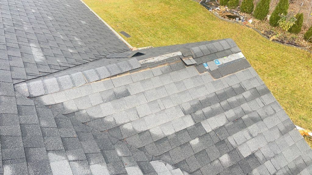 Roof Repair Alert - Wind Damage on Shingles image